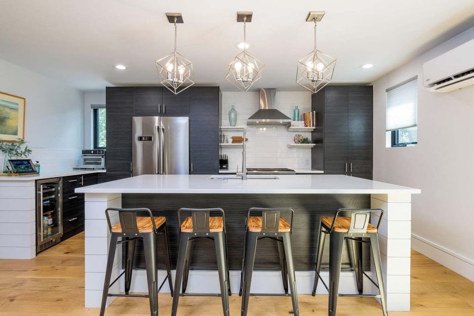 The Kitchen's center island provides causal countertop dinning for four.