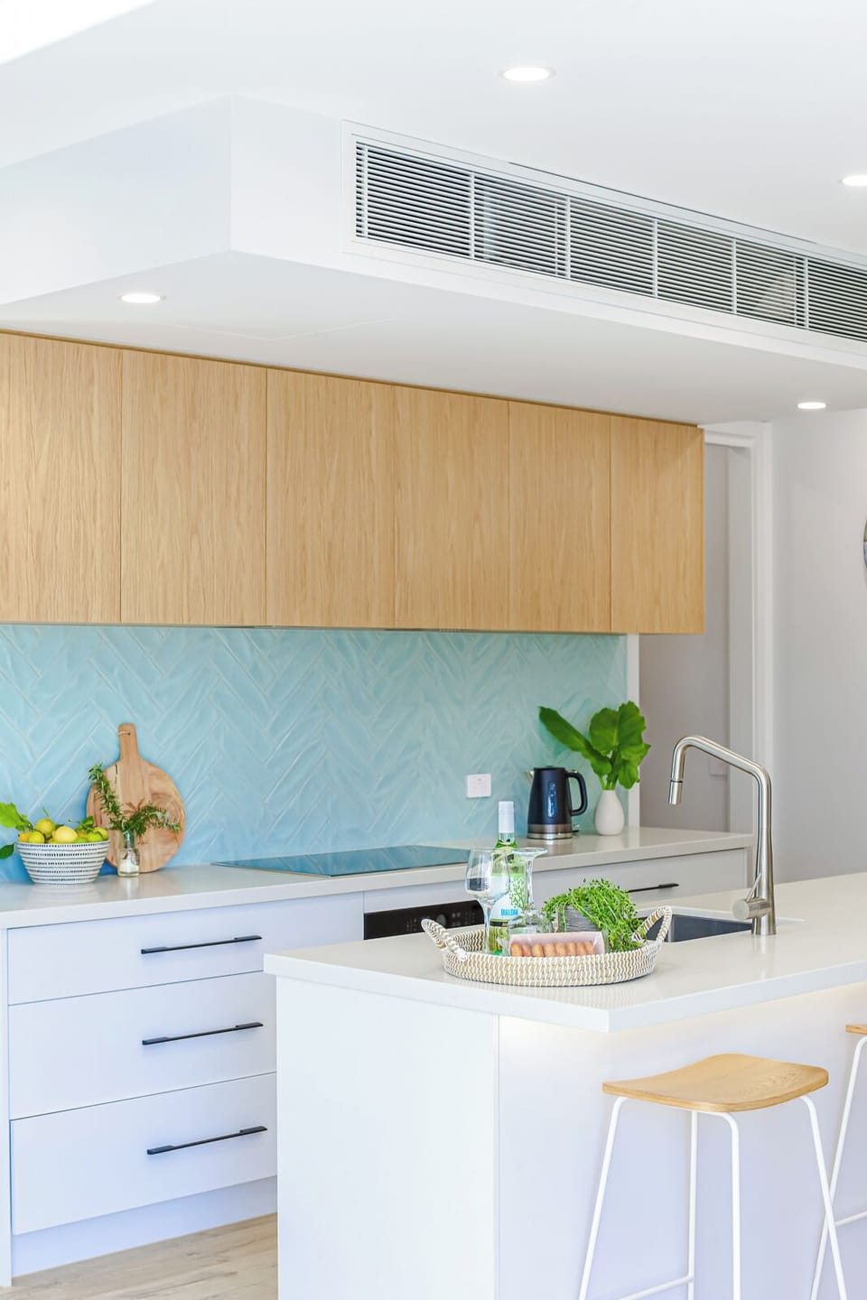 Open plan kitchen with oven, stove, fridge freezer with water and ice, coffee machine and more