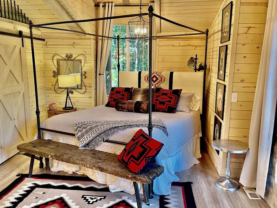 A plush rustic modern King Bed just off the living area of the studio