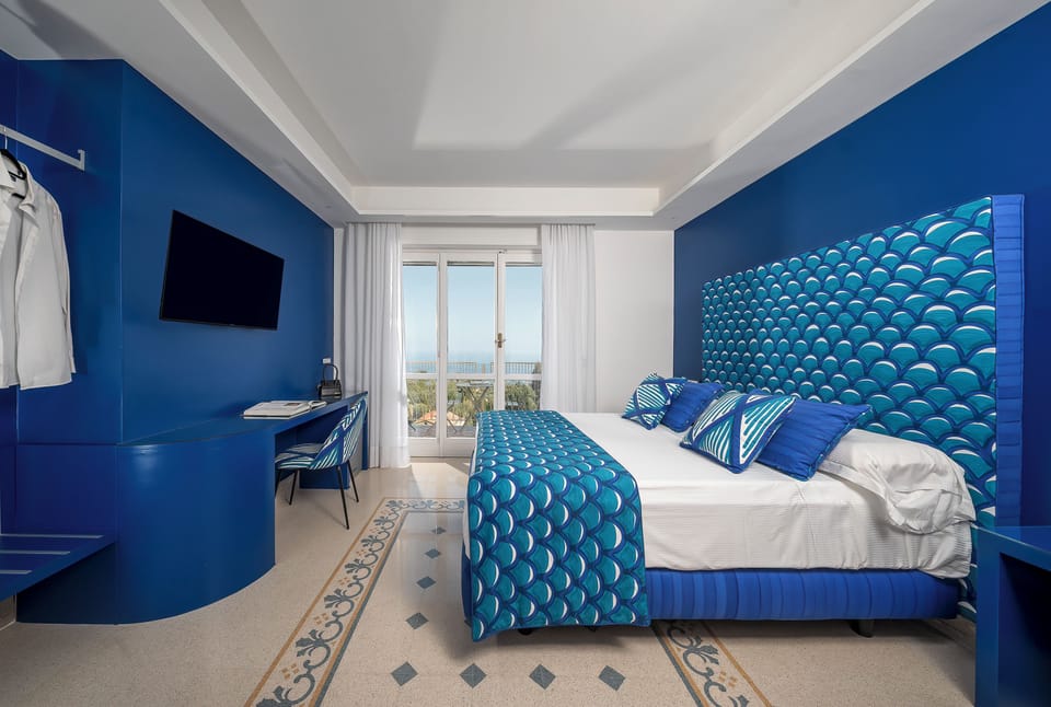 Panoramic Double Room, Balcony, Sea View | Minibar, in-room safe, desk, laptop workspace