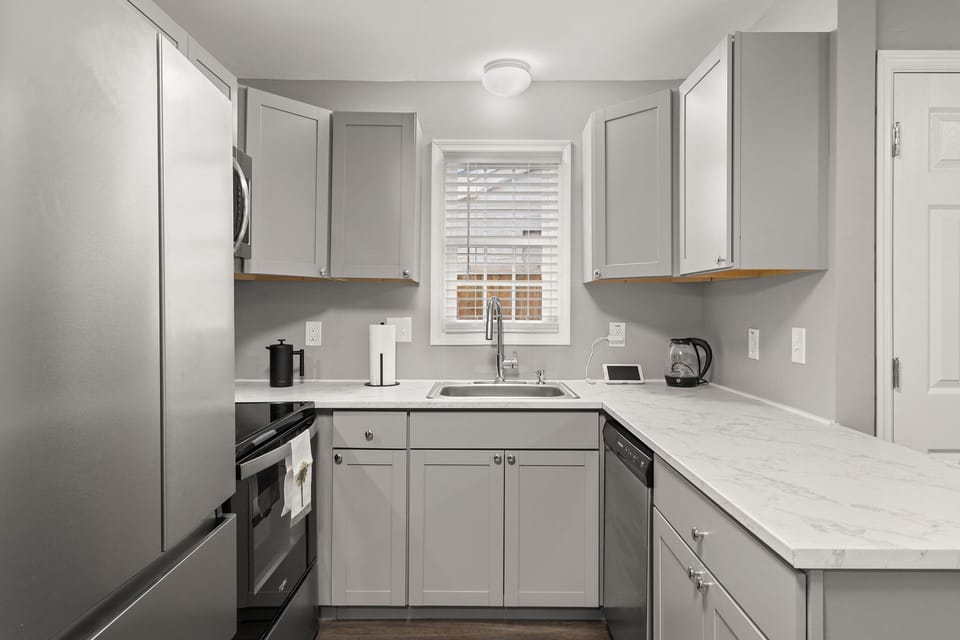 Modern kitchen with cabinets and ample space.