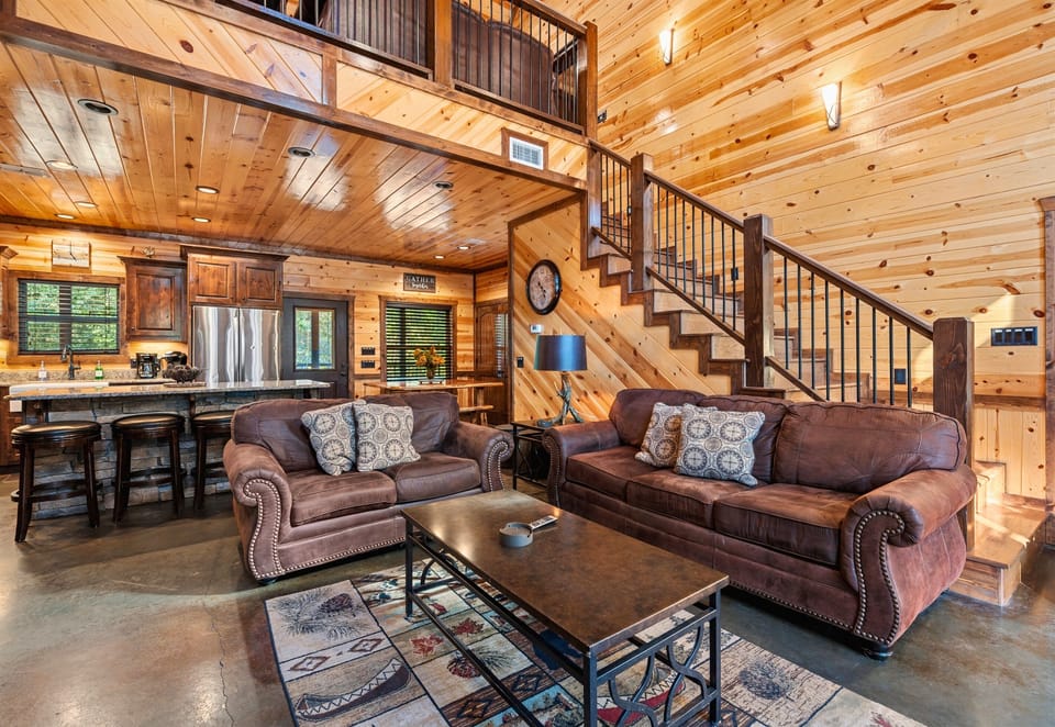 The open layout of the living room allows for easy flow between spaces, making it perfect for socializing or just spreading out and relaxing after a day of adventure.