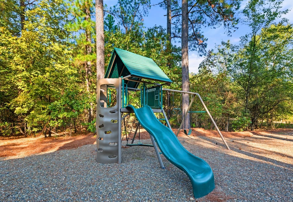 The kids will be all smiles as they swing and slide to their heart's content in this fun play area. It’s a great spot for families to enjoy the outdoors together.