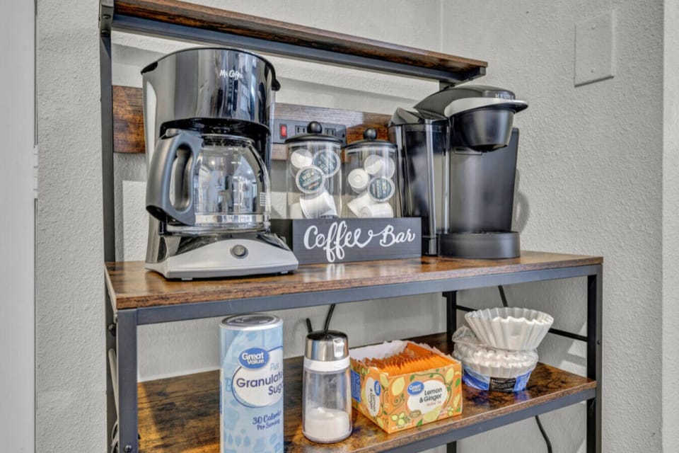 Start your mornings at our charming coffee bar, equipped with a Keurig, coffee maker, tea, sugar, and filters—all the essentials for your perfect brew!