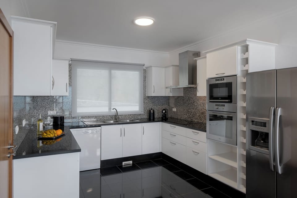 The Fully Equipped Kitchen At Atlanrtic Sunset Villa By Ourmadeira In Funchal