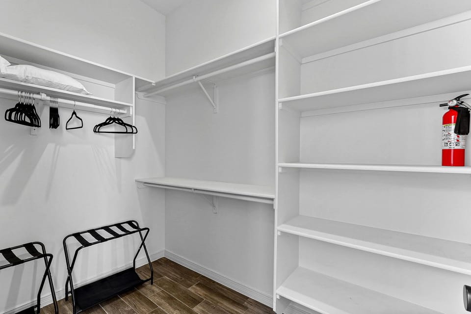 Luggage racks and hangers in closets
