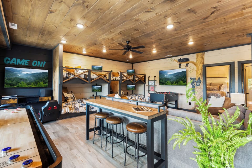 Two arcade consoles and foosball offer endless entertainment, creating memories 