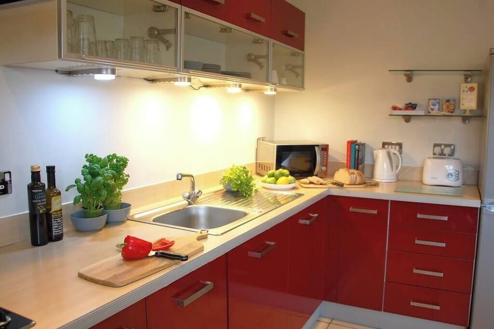 Fully equipped kitchen with washer/dryer, oven/hob, fridge/freezer, microwave, dishwasher, kettle, toaster, crockery/cutlery.