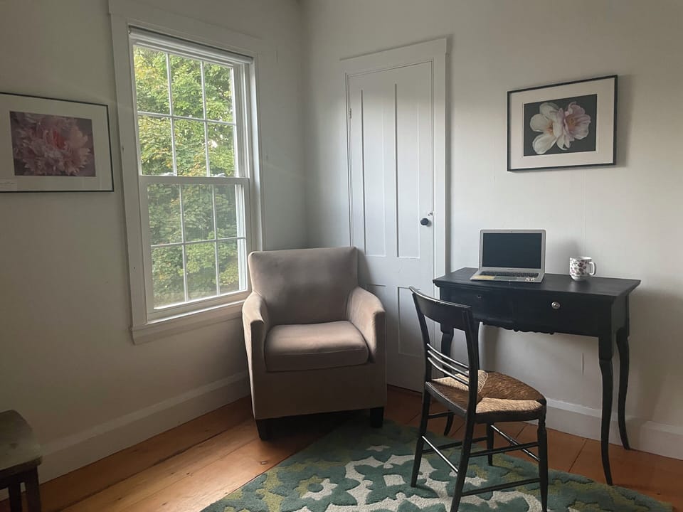 Upstairs den with mini-fridge, coffee maker, writing desk