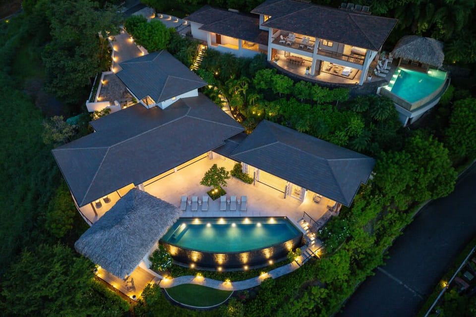 Two villas seamlessly linked by a lush, tropical pathway