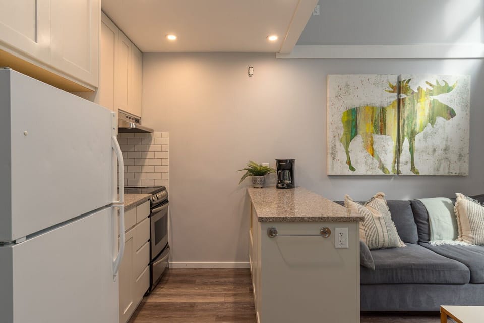 Sleek countertops and stainless appliances add a contemporary touch.