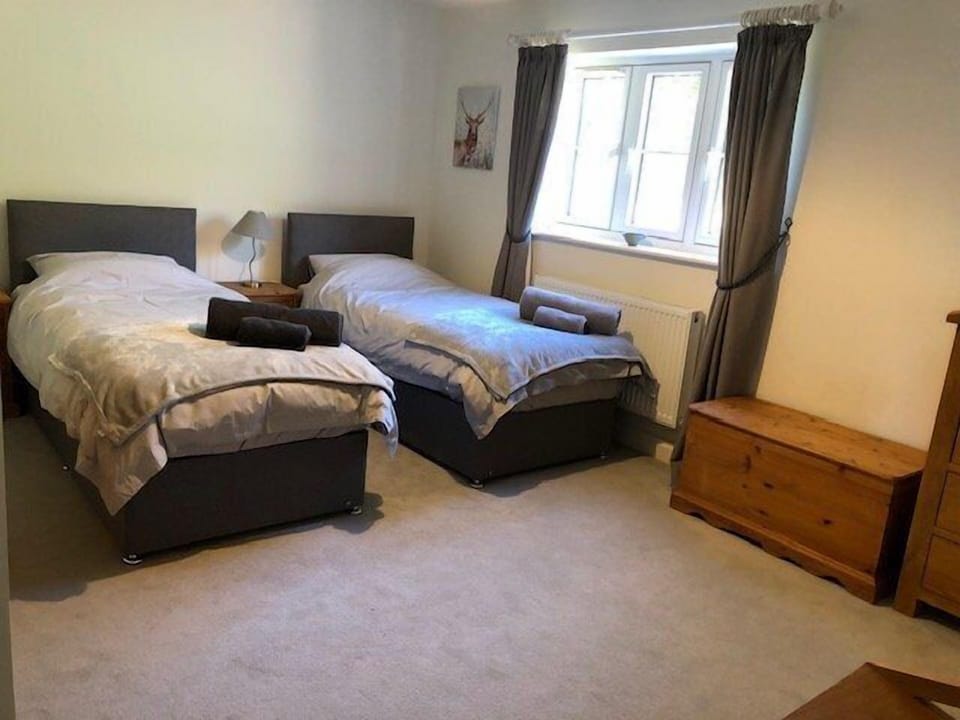 Grey room made up as two singles