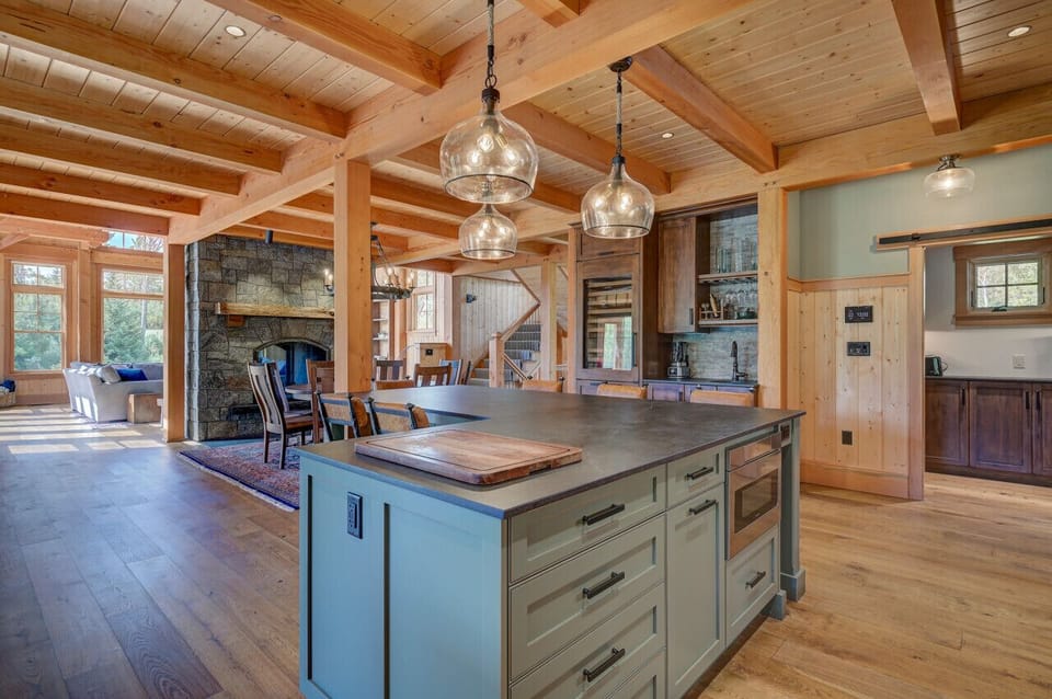 A chef’s gourmet kitchen with an open floor plan and high-end commercial appliances, perfect for cooking and entertaining.