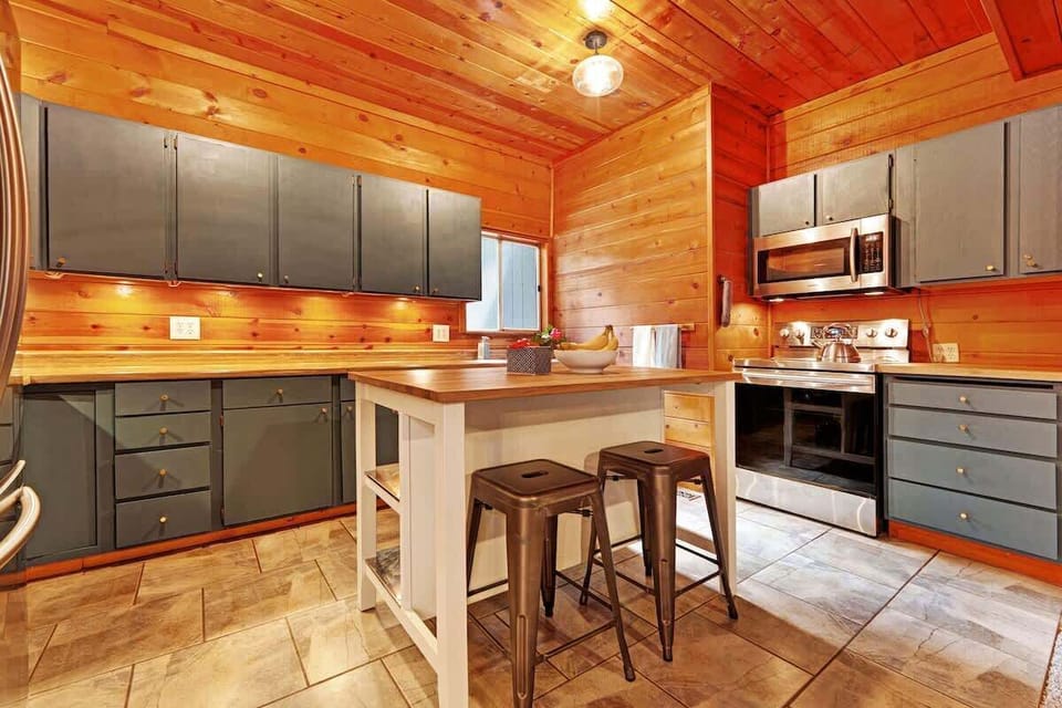 Cook and gather in this kitchen featuring bar seating and modern amenities.