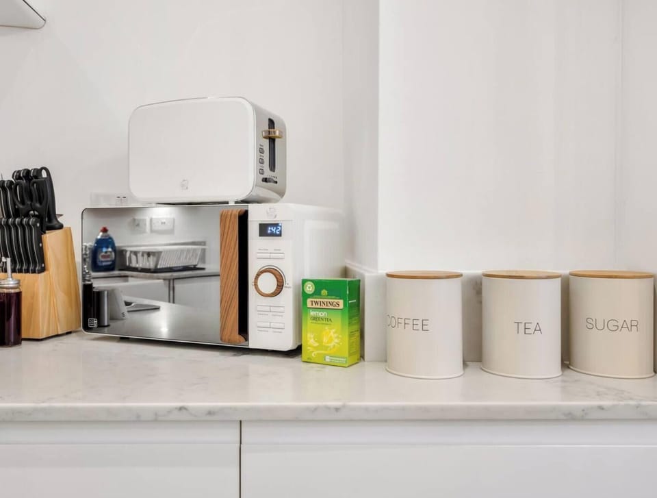 KITCHEN WITH MICROWAVE AND ESSENTIALS