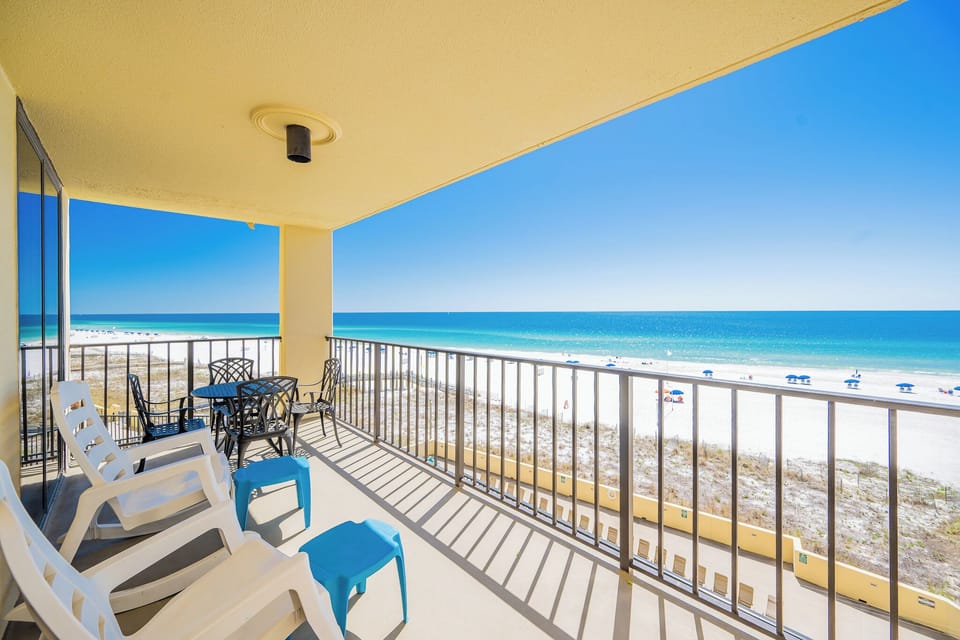 Enjoy breathtaking views from the balcony, featuring comfortable seating and a perfect spot for relaxation by the beach