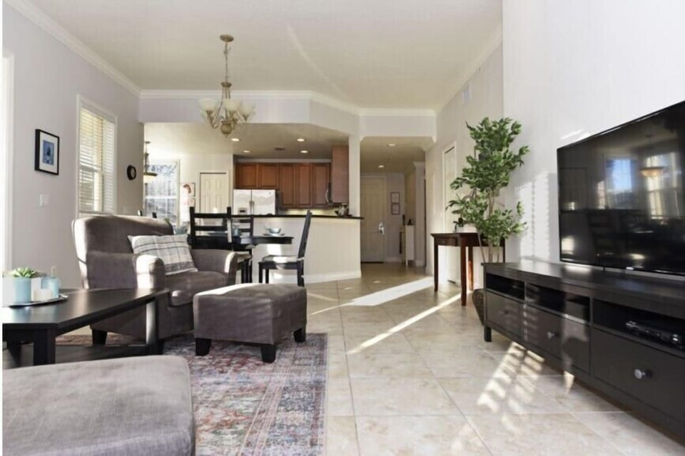 Open-concept dining and kitchen area with modern finishes and elegant decor.