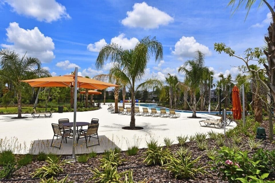Relax in the Solterra Resort Seating Area near Lazy River.  featuring comfy loungers and shaded seating 