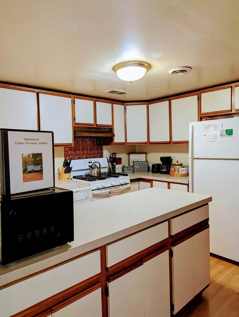 Step in from the entryway and you’ll find the kitchen, ready for your use. A handy binder (as shown in the photos) includes essential cabin details and our favorite local recommendations to help you make the most of your stay.