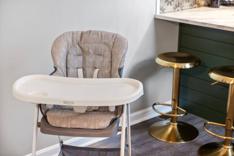 Little Guests Welcome Too – A comfy high chair means even the smallest travelers can join the table.