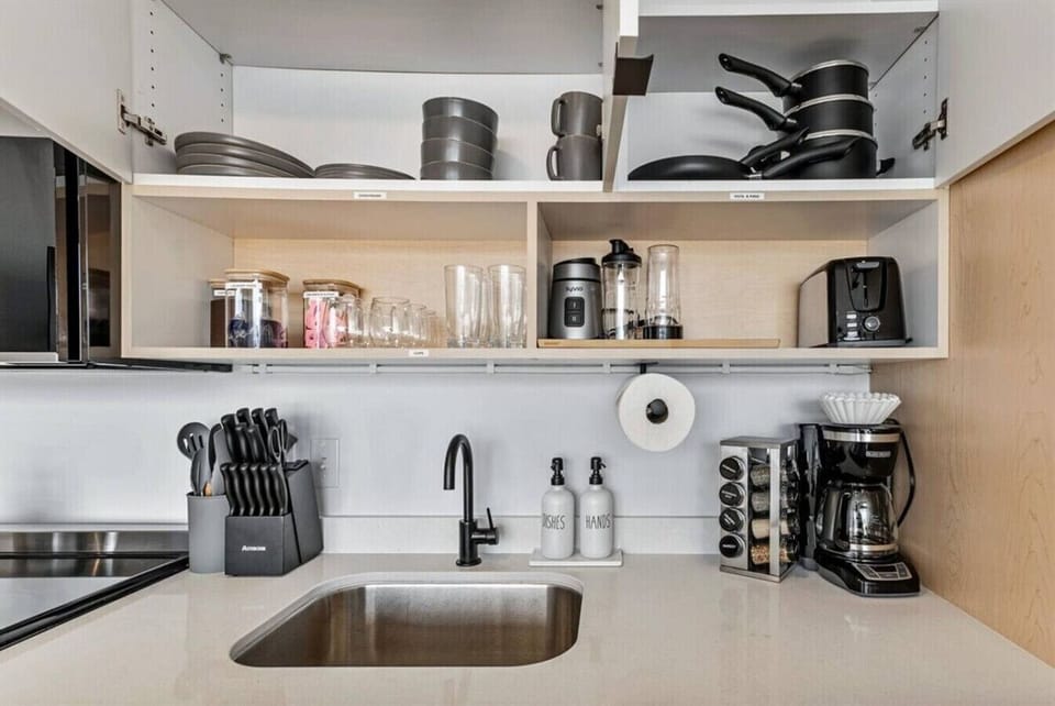 Coffee station & open shelving stocked w/ essentials for a convenient start to your day