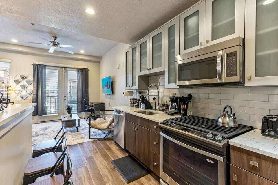 Spacious kitchen w/ island seating & direct flow into the living area for easy entertaining