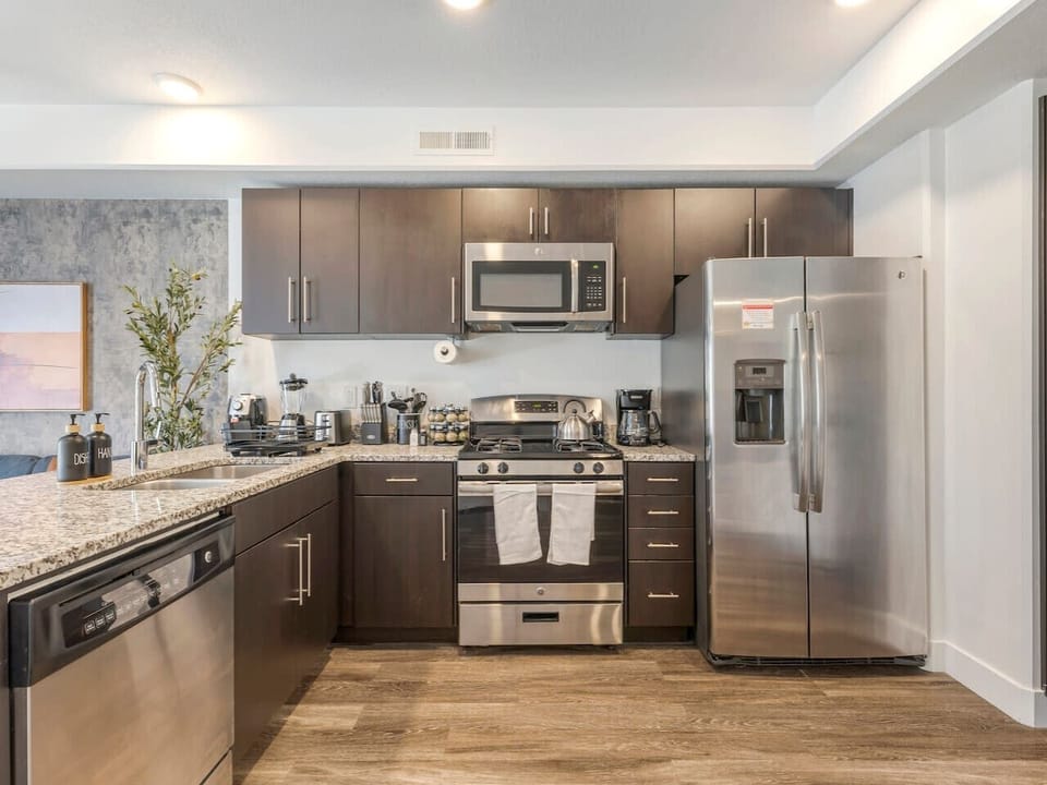 Modern kitchen with stainless steel appliances, granite countertops, and all essentials for home-cooked meals 🍳✨