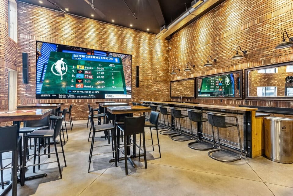 Lively bar area w/ large TVs, bar seating & space to unwind with friends