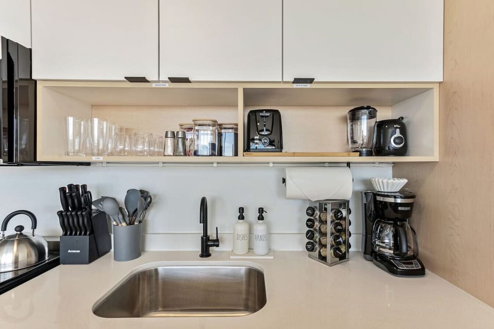 Modern kitchen setup with labeled storage, utensils, and spice rack for easy cooking 🥘✨