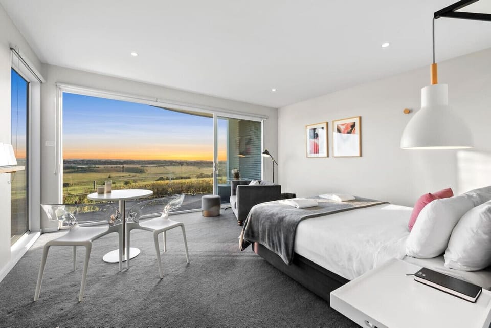🛏️ Luxurious spa bedroom with panoramic views and private seating
