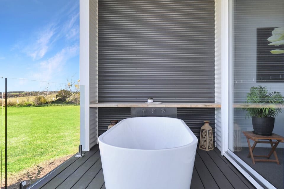 Private outdoor bath on deck with peaceful views