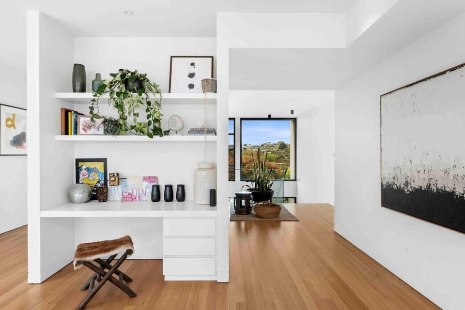 Bright hallway with built-in shelves and modern decor.