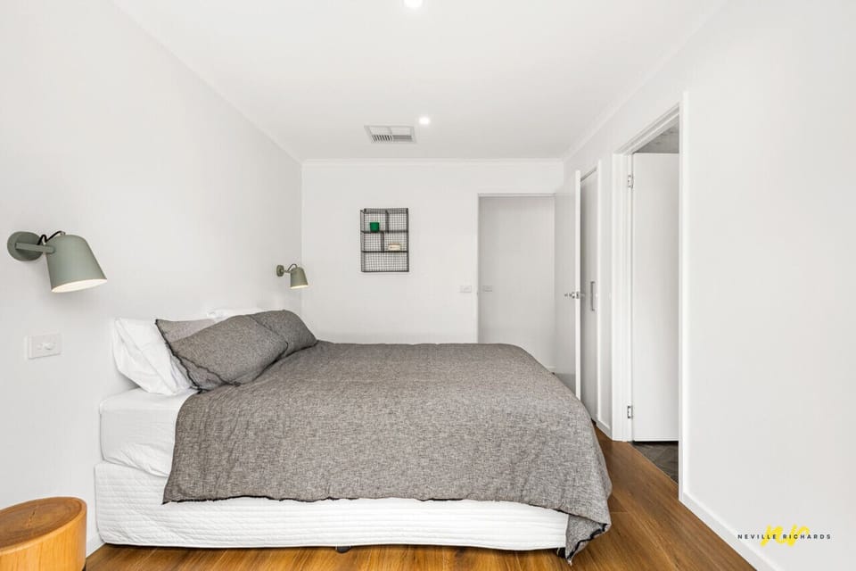 Minimalist bedroom with comfortable bedding and clean modern design
