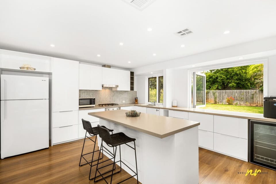 Fully equipped kitchen with breakfast bar and natural light