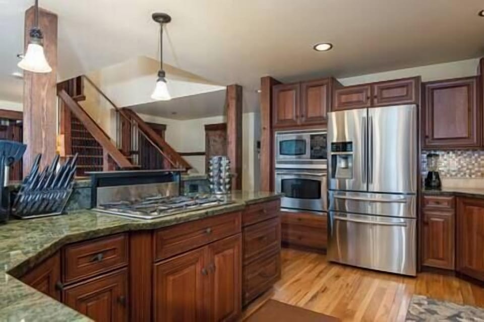 Large Kitchen with utensils, pots, pans, knives, spices 