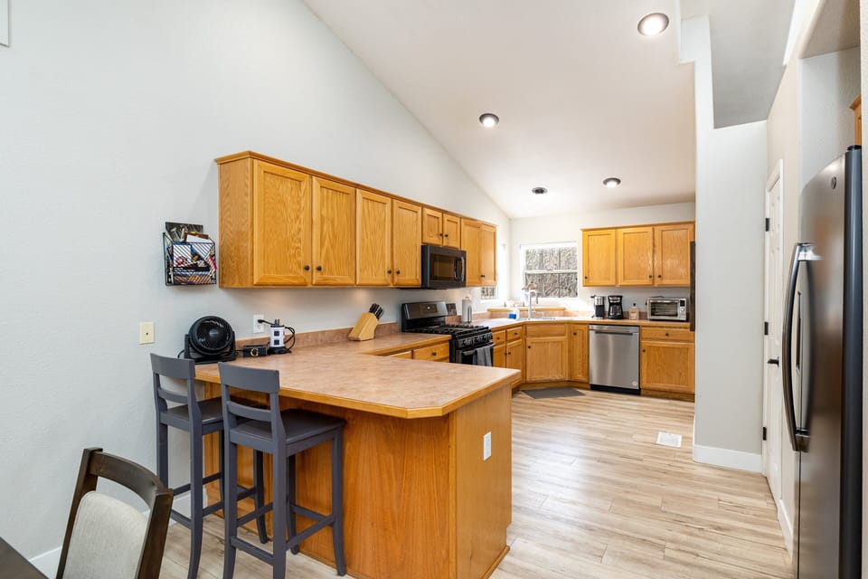 The fully equipped gourmet kitchen and spacious dining area make it easy to prepare and enjoy meals together