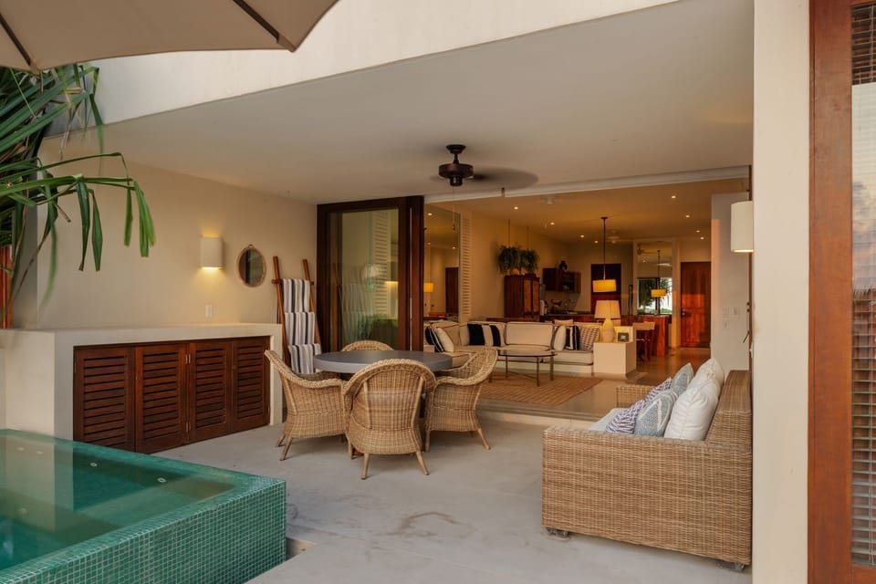 A beautiful transition between indoor and outdoor living, featuring a spacious terrace with comfortable seating.