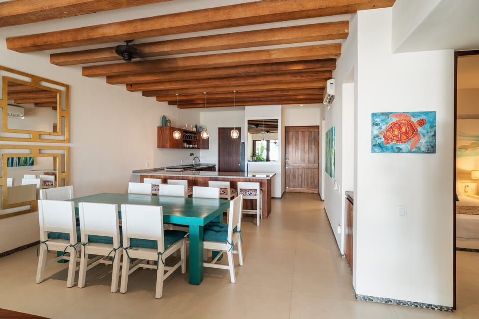 Airy open-concept living area with handcrafted details and a fully equipped kitchen.