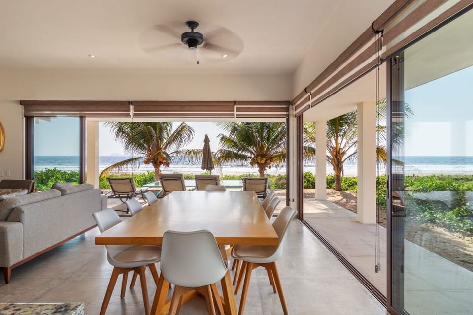 Dine with a view in this open-air dining space, offering stylish decor, natural light, and breathtaking beachfront scenery.