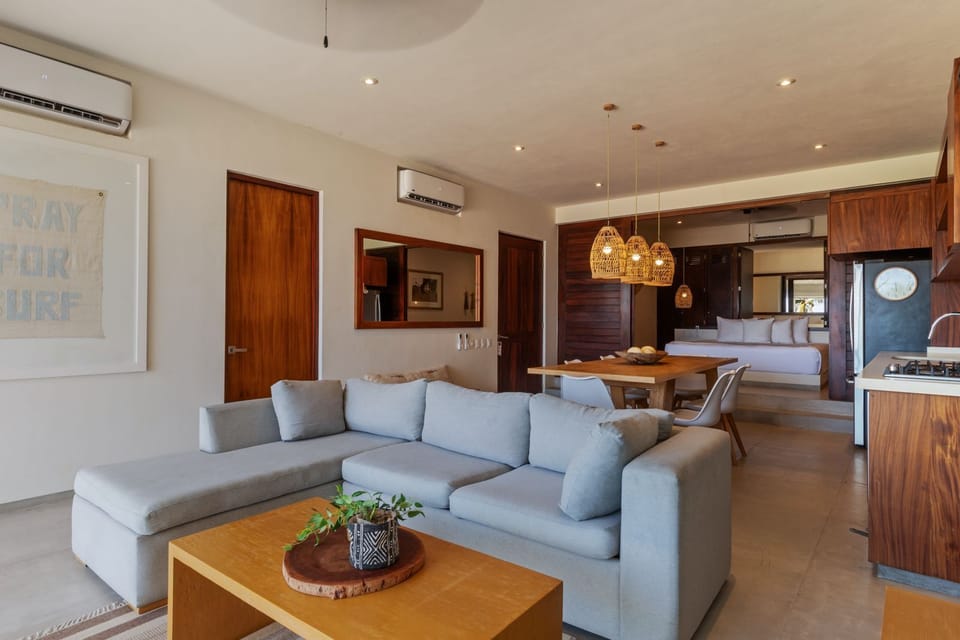 A cozy yet sophisticated living space with a fully equipped kitchen, inviting guests to unwind in a modern and stylish retreat.