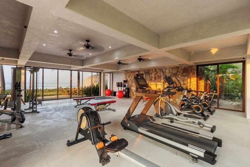 Stay active while enjoying ocean views in this spacious gym, featuring premium equipment and an open-air design.
