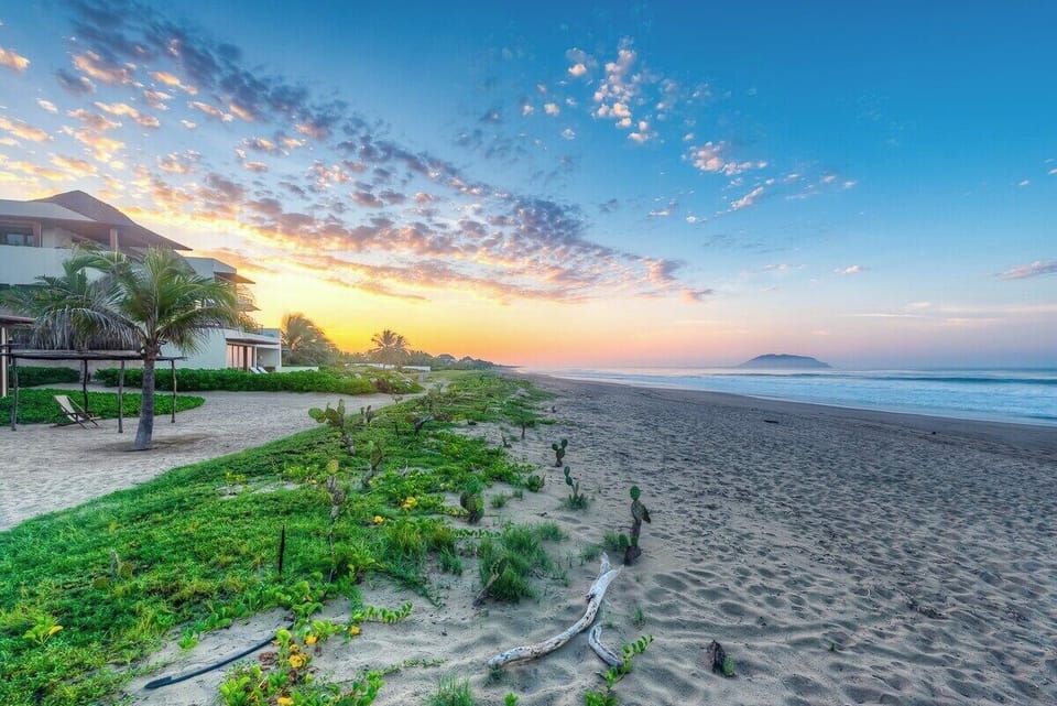 Surrounded by lush coastal greenery, this untouched stretch of paradise offers direct beach access and peaceful morning walks.