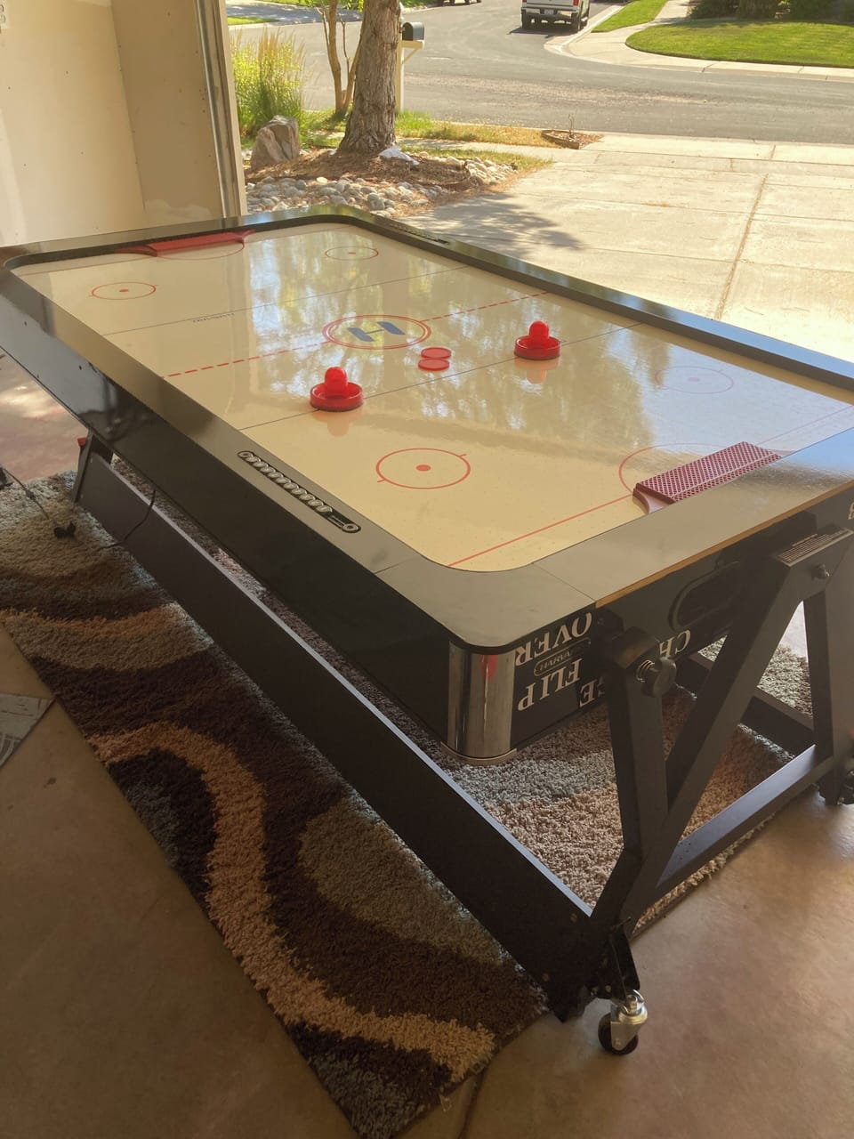 Air hockey/pool table flips over