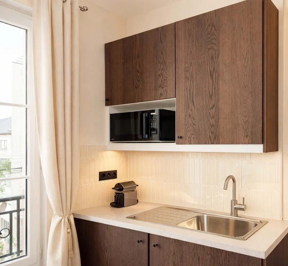 A kitchen ready with utensils and appliances to enhance your cooking experience.