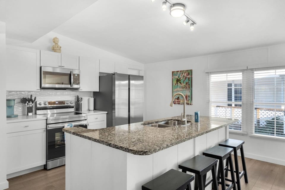 The kitchen is recently renovated and offers ample counter space