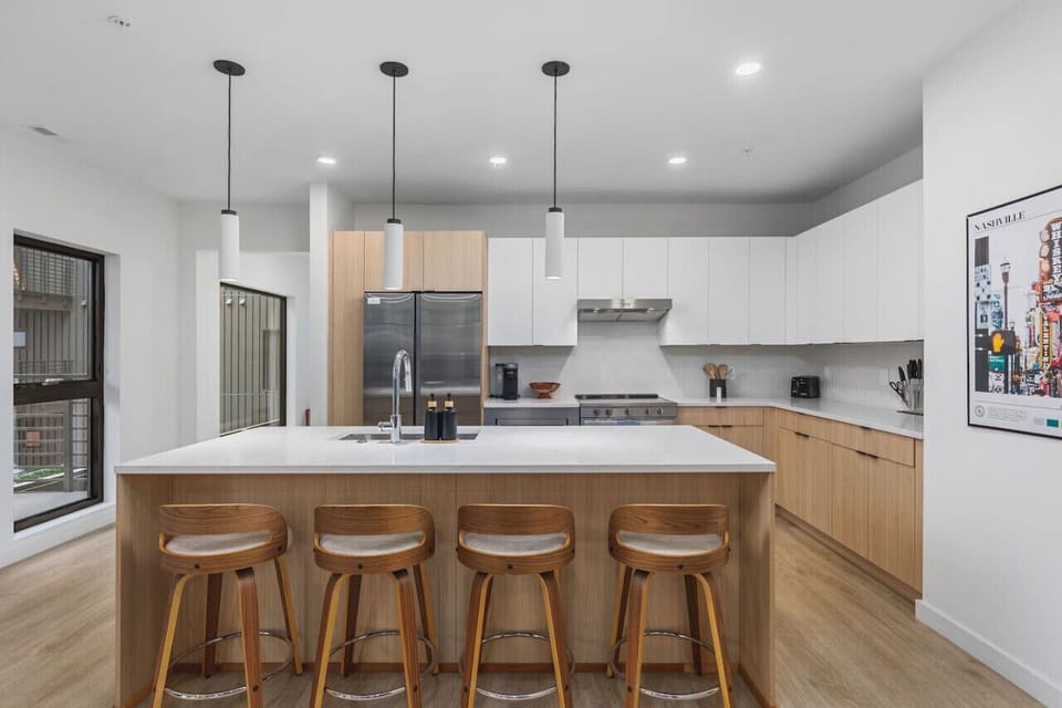 Seating for four at the island in this spacious contemporary kitchen.