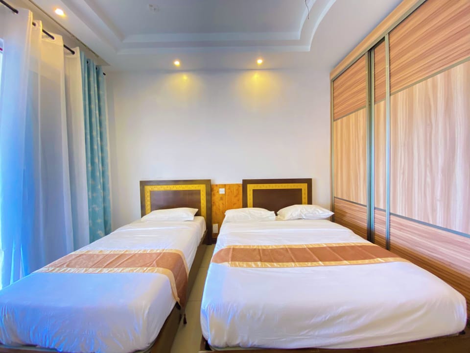 Deluxe Apartment, Partial Ocean View | 2 bedrooms, desk, laptop workspace, free WiFi