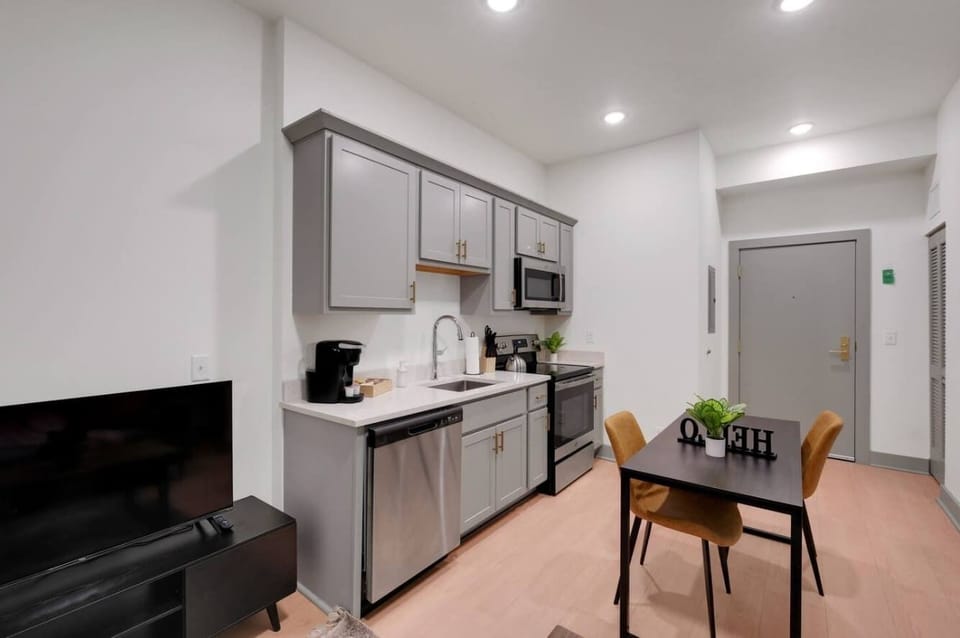 Kitchen: Modern kitchen with sleek stainless-steel appliances and ample counter space.