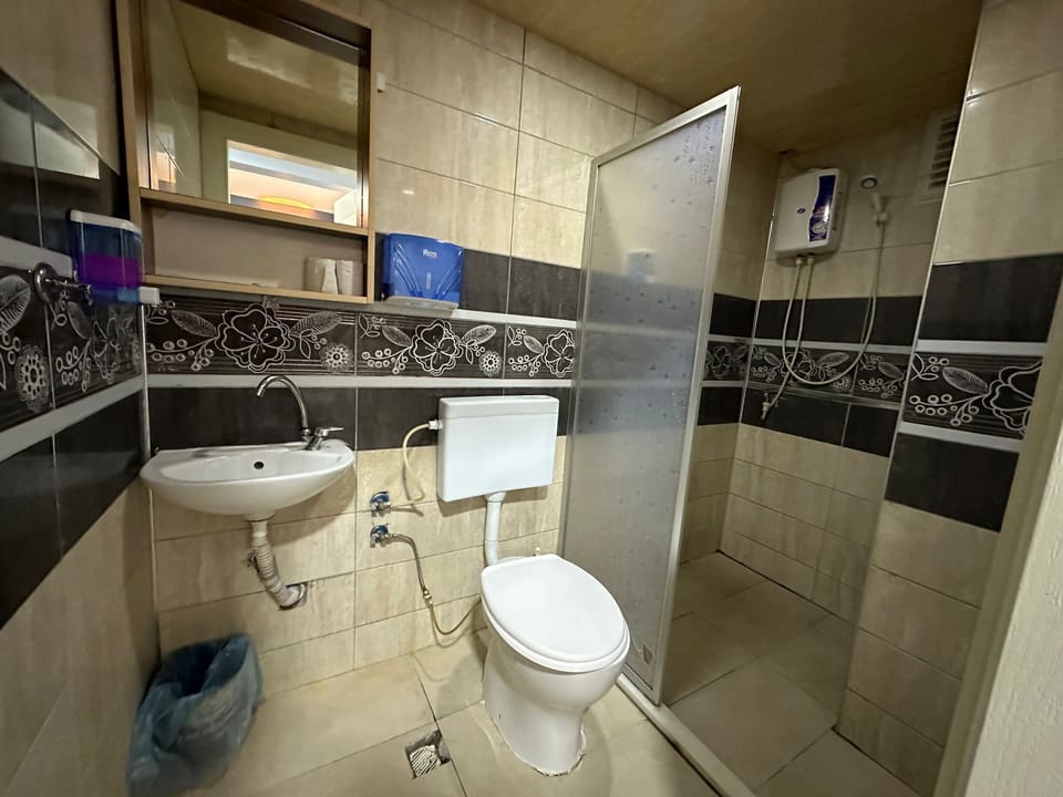 Shower, hair dryer, slippers, towels