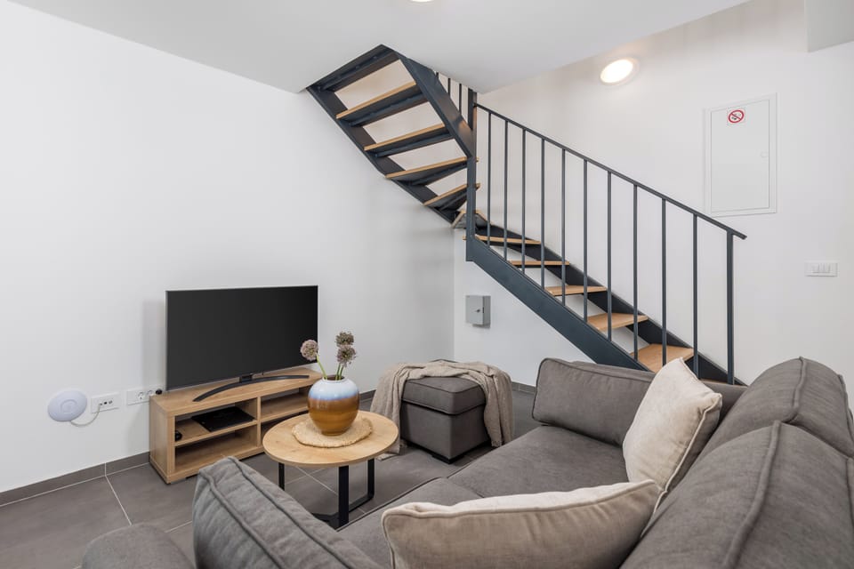 Family House, Partial Sea View | Living area | 80-cm LCD TV with digital channels